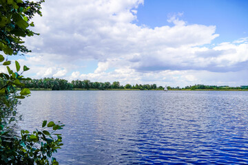 Ehrlichsee near Oberhausen-Rheinhausen. Lake with surrounding landscape in summer.
