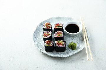 Assorted vegan sushi rolls with vegetables and tofu