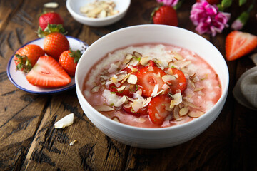 Homemade porridge with strawberry and almond