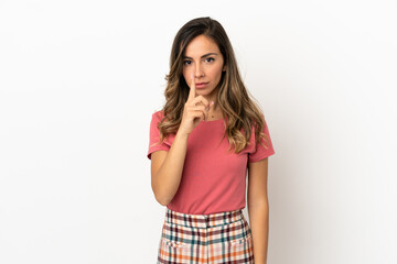 Young woman over isolated background showing a sign of silence gesture putting finger in mouth