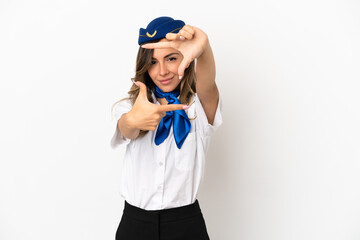 Airplane stewardess over isolated white background focusing face. Framing symbol