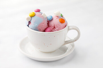 Colorful ice cream with candies on a white background