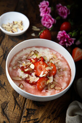 Homemade porridge with strawberry and almond