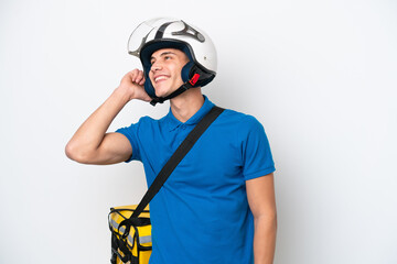 Young caucasian man with thermal backpack isolated on white background thinking an idea