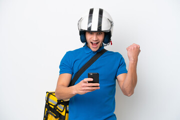 Young caucasian man with thermal backpack isolated on white background surprised and sending a message