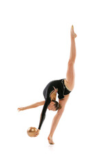 Dynamic portrait of young professional rhythmic gymnastics artist training with ball isolated on white background. Concept of sport, action, aspiration