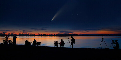 Comet Neowise and crowd of people silhouetted by the Ottawa river watching and photographing the comet - obrazy, fototapety, plakaty