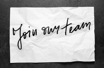 Join our team. Lettering on crumpled white paper. Handwritten text. Inspirational quotes.