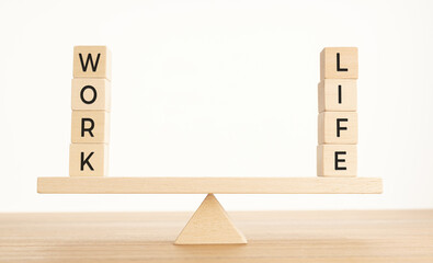 Balance Between Life And Work concept. Wooden blocks with word on Seesaw. Copy space
