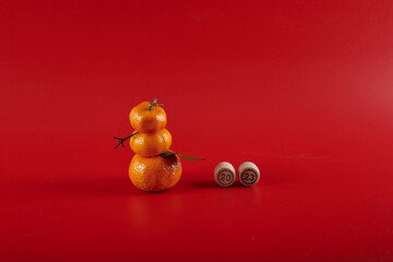 2023 and a tangerine snowman on a red background