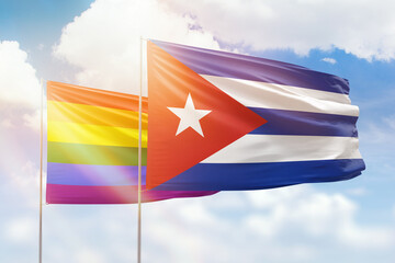 Sunny blue sky and flags of lgbt and cuba