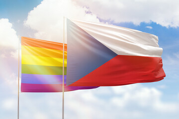Sunny blue sky and flags of lgbt and czechia