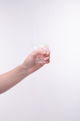 Plastic cup crumpled in hand