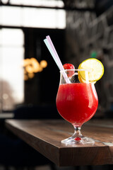 Red cocktail. Glass of Garibaldi cocktail.