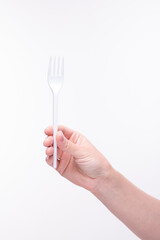 Plastic fork in hand