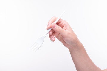 Plastic fork in hand