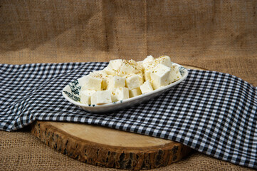fresh cheese in a rustic setting. White cheese feta, tea, bread.