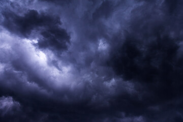 Naklejka na ściany i meble Storm sky with dark blue violet cumulus rainy clouds background texture, thunderstorm