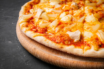 hot delicious traditional italian pizza on a dark stone background