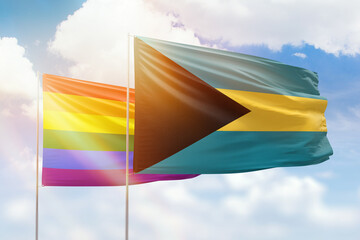 Sunny blue sky and flags of lgbt and bahamas