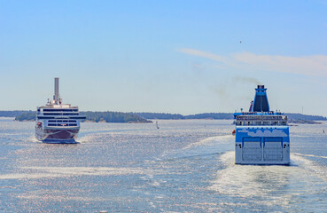 ships in the Baltic sea. Blue water of the Stockholm fiord, blue sky with clouds