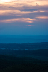 sunset bright dramatic colorful sky over mountain shadow at evening