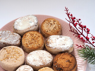 Plate with traditional Spanish sweets Polvorones y Mantecados. View from above.