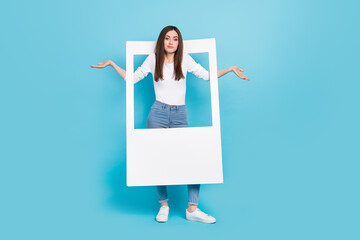 Full size photo of funny girl with white frame shrug shoulders not happy with photoshoot isolated...