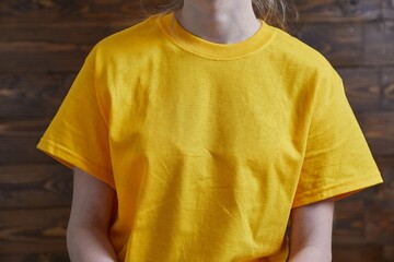 Girl in T-shirt sitting on the floor