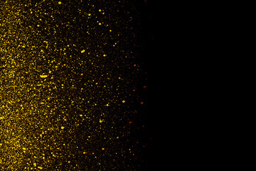 Golden color shiny paint particles on black background	
