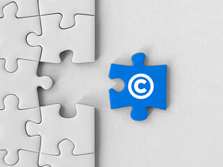 Property and intellectual rights. Copyright icon on a puzzle piece
