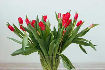 Red tulips on the table. Beautiful flowers
