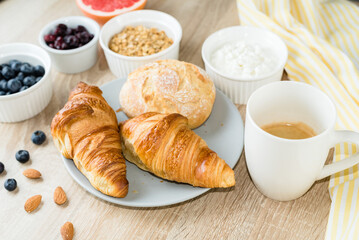 Healthy breakfast. Croissants, buns, cottage cheese, berries and fruits and berries.  Long banner format