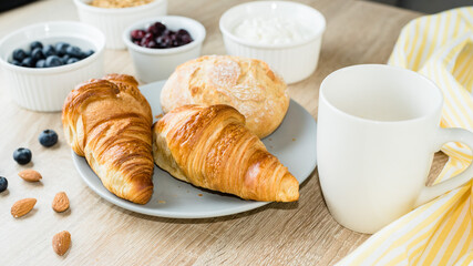 Healthy breakfast. Croissants, buns, cottage cheese, berries and fruits and berries.  Long banner format