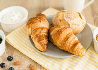 Healthy breakfast. Croissants, buns, cottage cheese, berries and fruits and berries