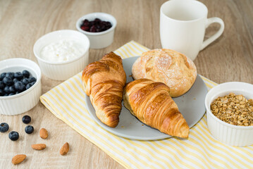 Healthy breakfast. Croissants, buns, cottage cheese, berries and fruits and berries