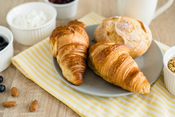 Healthy breakfast. Croissants, buns, cottage cheese, berries and fruits and berries