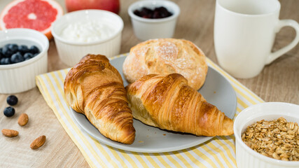 Healthy breakfast. Croissants, buns, cottage cheese, berries and fruits and berries.  Long banner format