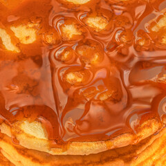Pancakes with maple syrup as a textured background.  Pancakes Pattern.