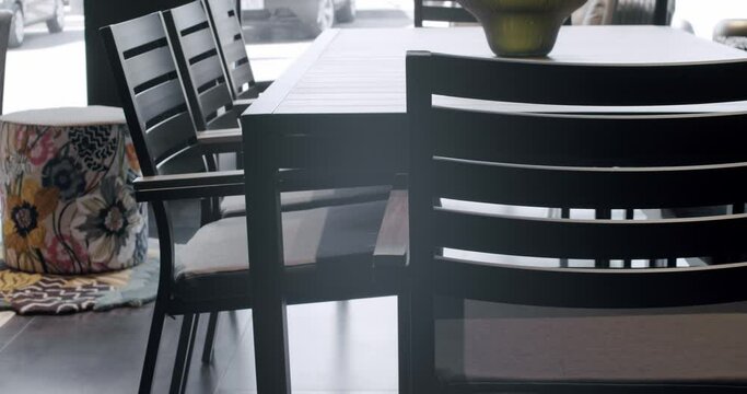 Summer black Terrace furniture with minimalist chair and table. Furniture for garden, Modern Luxury Villa. Minimalist apartment. Outdoor table and chairs for garden park.Modern Chairs for luxury villa