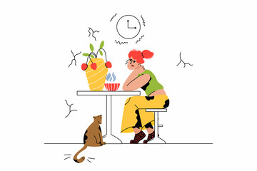 The girl is sitting at the table. Bored look, upset woman, thoughtful. A cat looks at a woman, a pet