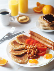 Traditional British breakfast with sausages and beans	