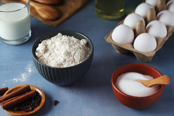 Food ingredients for baking: flour, eggs, milk, sugar