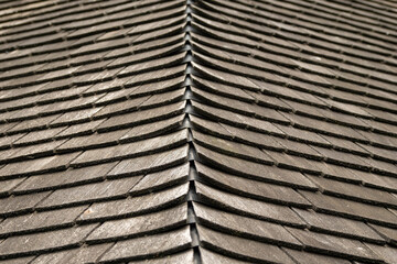 Wooden roof tiles. Old and weathered material.