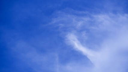 Blue sky with fluffy white clouds. Beautiful nature background.