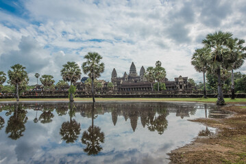 Fototapeta premium Angkor Wat, an ancient sandstone castle, is a world heritage site in the reflection of water in a pond in front of Siem Reap, Cambodia
