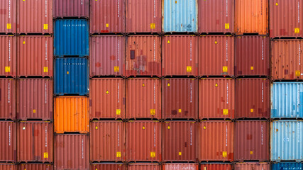 Fototapeta premium Stack of containers industrial containers box from cargo freight ship for global business logistic transportation import export.