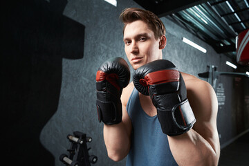 Purposeful young sportsperson preparing for gym workout