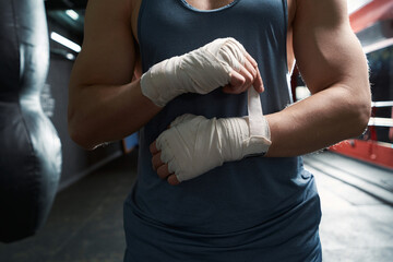 Sportsperson preparing for boxing training at gym