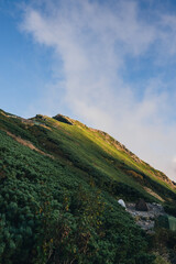 唐松岳頂上、夕陽の光